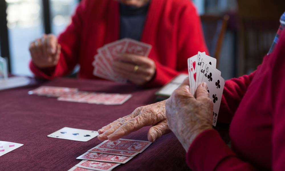 Retired people playing card games to help improve their memory