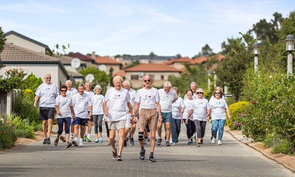 Elderly folk exercising together
