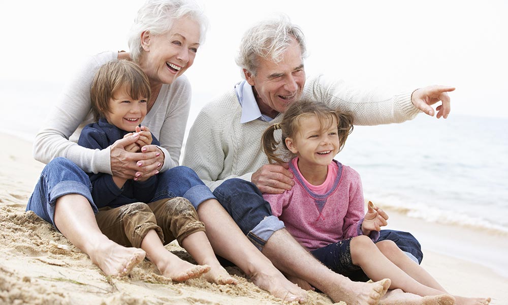 Healthy 70s retired couple with their grandkids