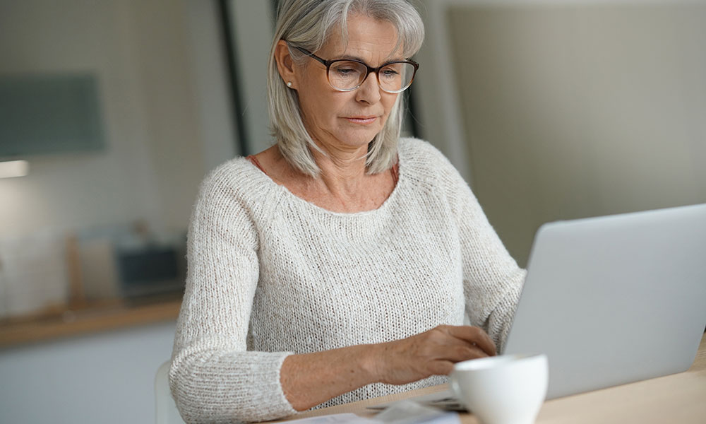 Elderly woman avoiding online scams