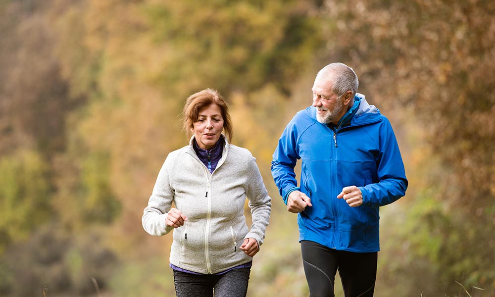 Retired couple running in their 60s