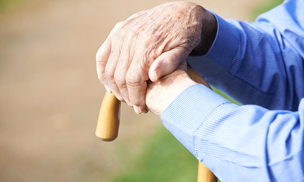 Retired pensioner suffering from dementia sitting contemplating life