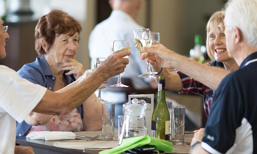 Retired people eating lunch at Evergreen Broadacres