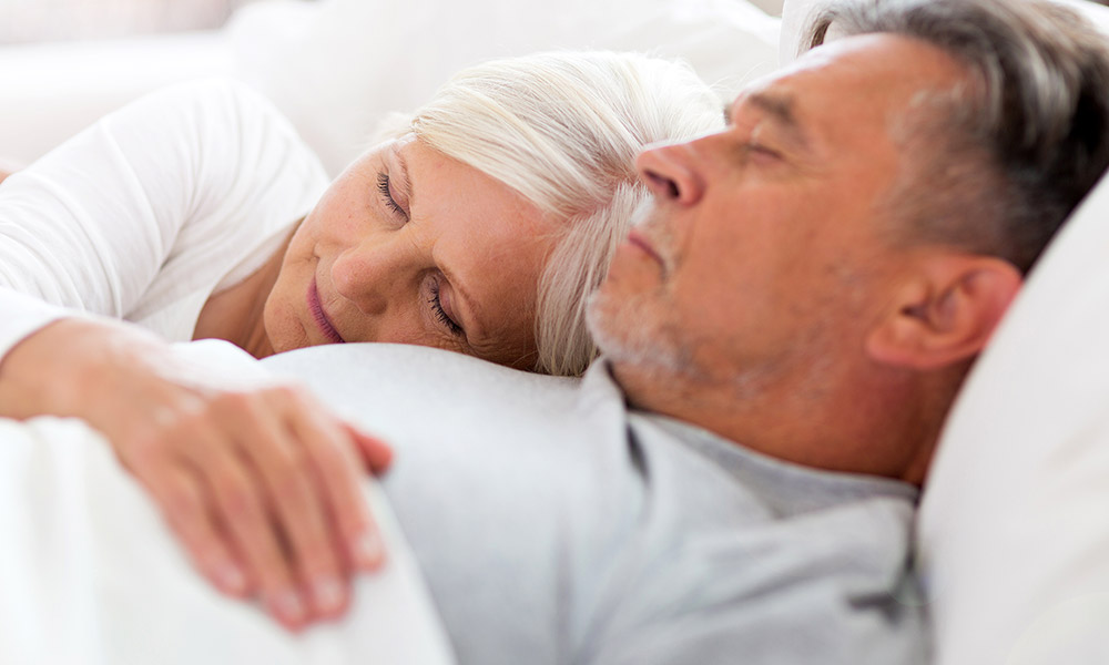 Retired couple sleeping