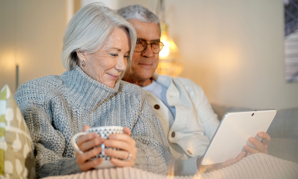 Retired couple getting cosy in winter